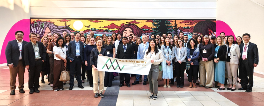 A group of people holding a banner
AI-generated content may be incorrect.